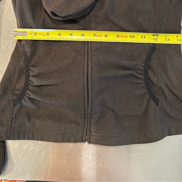 North face Small, embossed pattern, black fleece, front pockets with hood. - Picture 14 of 15